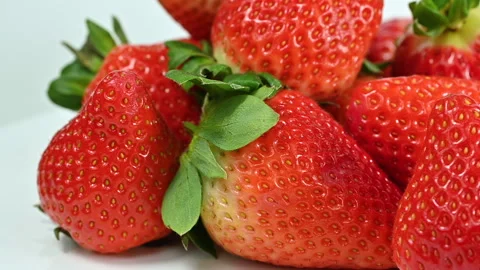 Red ripe strawberries on white background, macro closeup Stock Footage 301448047