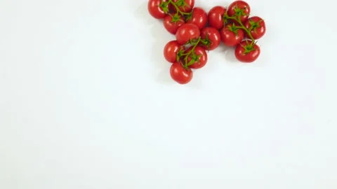 Red ripe tomatoes on a white background. Moving food background. Tomatoes on  Video stock 155148773
