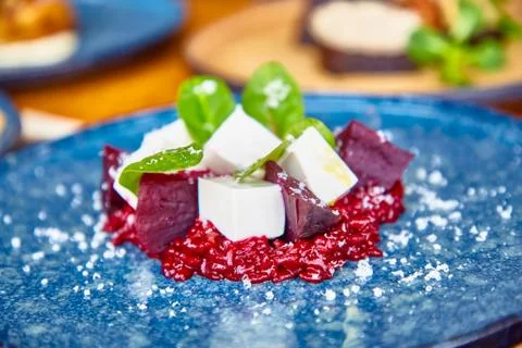 Red risotto with beetroot and feta cheese Stock Photos