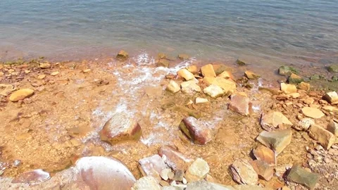 Red river estuary with rusty stones Stock Footage 337588313
