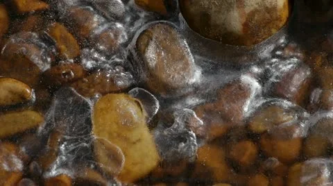 Red River Rocks covered in thin sheet of Ice 2 Stock Footage 22071328