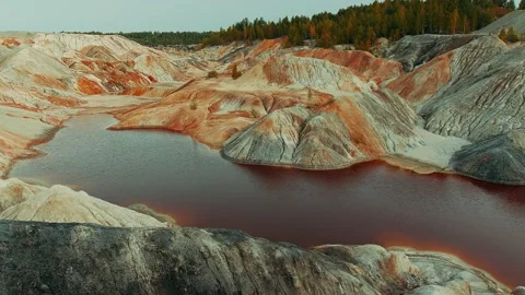 Red river surrounded by mountains Stock Footage 141150894