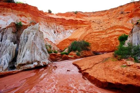 Red river through the Ham Tien canyon, Mui Ne, Vietnam. Stock Photos