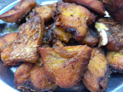 Red roast fish cut into small pieces. Stock Photos
