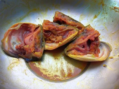 Red roast fish cut into small pieces. Stock Photos