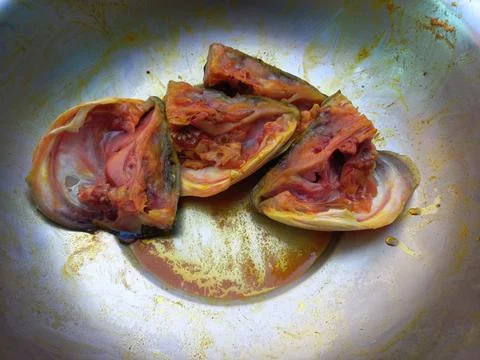 Red roast fish cut into small pieces. Stock Photos