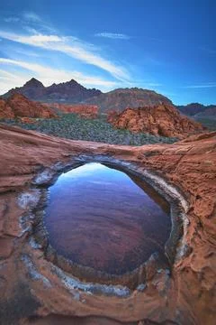 Red Rock Basin with Water Reflection at Sunrise in Desert Landscape Stock Photos