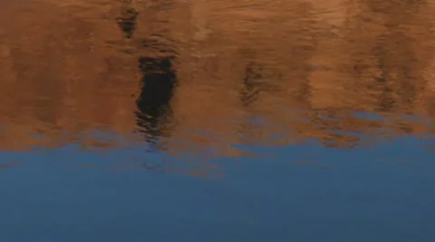 Red rock cliffs reflected in water on the Colorado River Stock Footage 21646221