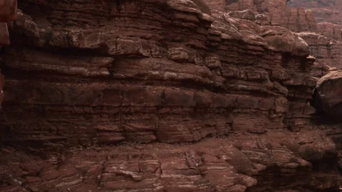 Red rock formation in canyon with layered textures and colors Stock Footage 338320118