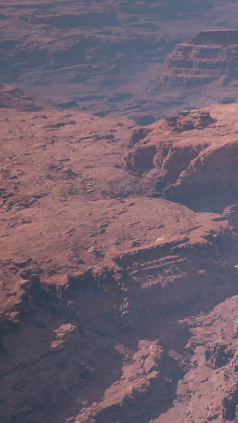 Red rock formations at a canyon during the day in a desert region Stock Footage 346758955