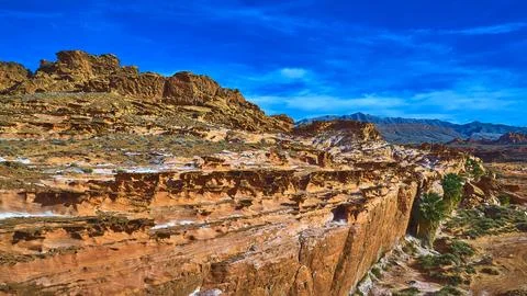 Red Rock Formations Palm Trees and Dramatic Sky in Desert Landscape Aerial Stock Photos