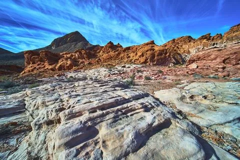 Red Rock Formations Sandstone Textures and Dramatic Blue Sky in Desert Land.. Stock Photos