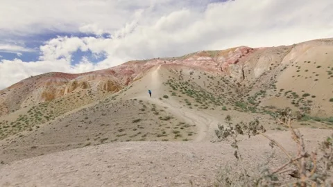 Red rock mountains form a dramatic landscape late in the afternoon Stock Footage 278022028