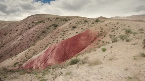 Red rock mountains form a dramatic landscape late in the afternoon Stock Footage 278022071