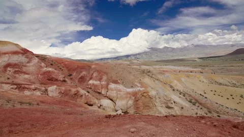 Red rock mountains form a dramatic landscape late in the afternoon Stock Footage 278022153
