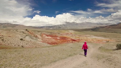 Red rock mountains form a dramatic landscape late in the afternoon Stock Footage 278022185