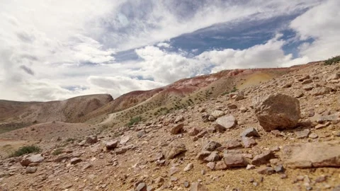 Red rock mountains form a dramatic landscape late in the afternoon Stock Footage 278022210