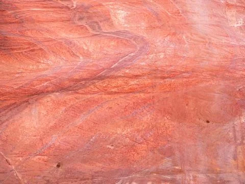 Red rock stone sand texture background. Red Stone wall in Petra, Jordan. Stock Photos