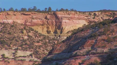 Red rock striations in cliff El Morro Stock Footage 61575357