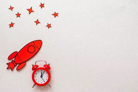 Red rocket border with alarm clock and stars Stock Photos