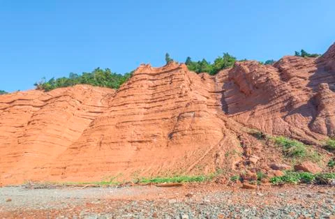 Red rocks of the blomidon cliffs Stock Photos