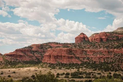 Red rocks, cliffs and bluffs in warm afternoon sun Stock Photos
