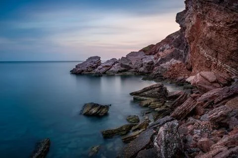 Red rocks coast Stock Photos