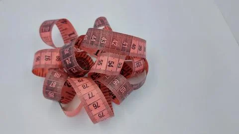 The red roll meter that tailors usually use to measure clothes or cloth Stock Photos