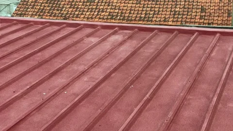 Red rooftop texture with corrugated metal roof pattern Stock Footage 341897533