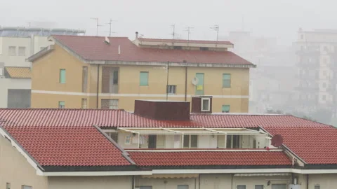 Red Rooftops Of Small Buildings Under The Rainstorm Stock Footage 288892859