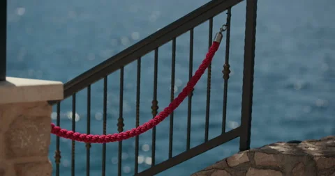 Red Rope Barrier on Waterfront Railing in Primosten Stock Footage 336928505