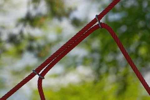 Red ropes on a playing goround Stock Photos