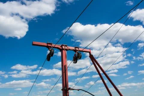 Red ropeway cablecaar construction against blue sky and beautiful white cloud Stock Photos