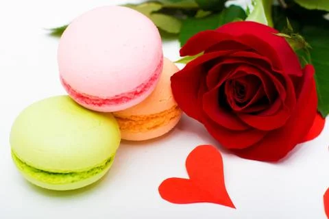 Red rose, biscuits macaroons,  heart Stock Photos