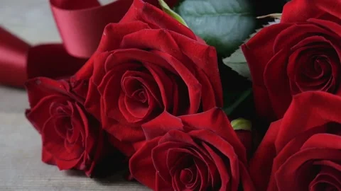 Red rose flowers on the table. Texture of valentine's day. Valentine's Day Stock Footage 220630034
