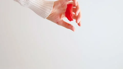 Red rose petals are falling from a woman's hand. Stock Footage 150546469