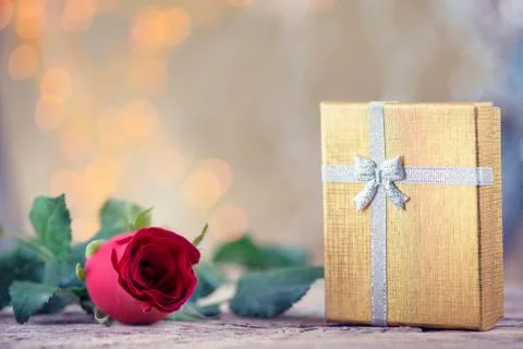 Red rose with present on beautiful background for Valentine's day Stock Photos