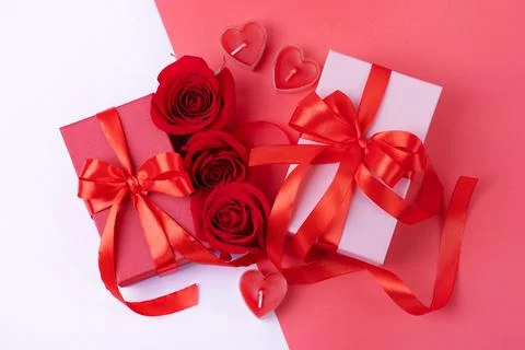 Red roses and gift boxes Stock Photos