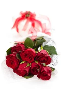 Red roses and gift. Stock Photos