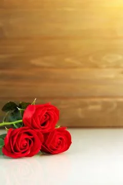 Red roses on table with copy space Stock Photos