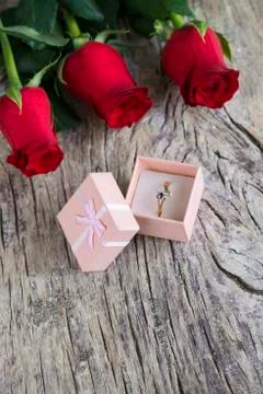 Red roses with wedding ring Stock Photos