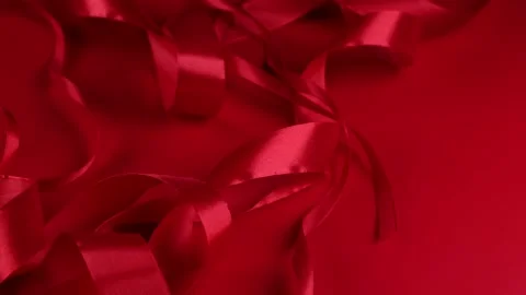 Red rotating background with red satin ribbons. concept for celebrating Stock Footage 167473549