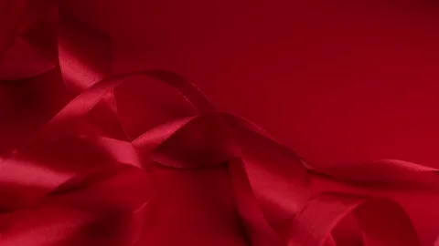 Red rotating background with red satin ribbons. concept for celebrating Stock Footage 168048222
