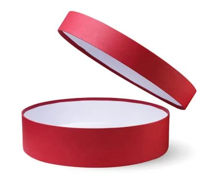 Red round box with an open lid on a white background. Isolated Stock Photos
