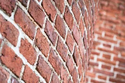 Red round brick wall pattern. Photo background Stock Photos