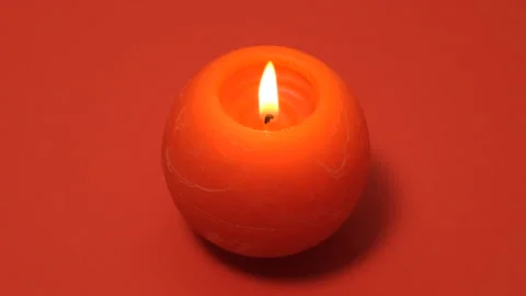 Red round burning candle isolated on red background. Full HD slow motion Stock Footage 171139784