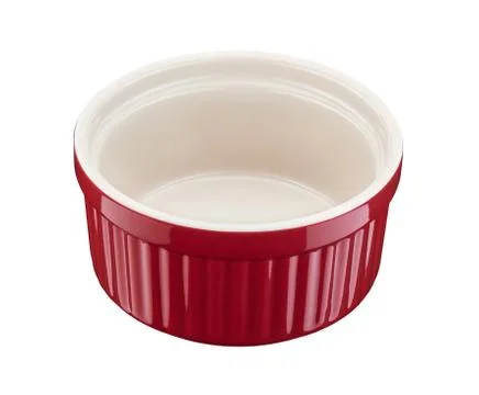 Red round empty porcelain ramekin on a white background 스톡 사진