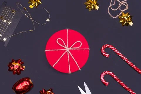 Red round gift box on black background, new year and Christmas gift wrapping Stock Photos