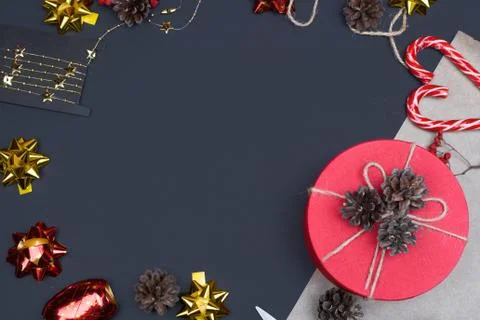 Red round gift box on black background, new year and Christmas gift wrapping Stock Photos