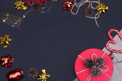 Red round gift box on black background, new year and Christmas gift wrapping Stock Photos